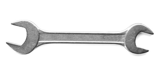 Steel spanner on white background, top view
