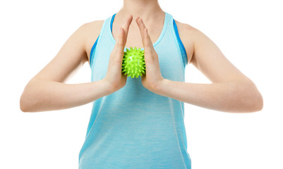 Woman doing exercises with rubber ball on white background