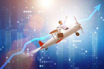 Businessman flying on vintage old airplane © Elnur