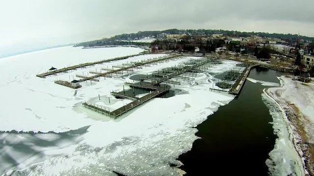 Petoskey Harbor Breakwater in spring with frozen lake
