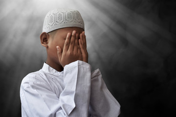 Asian muslim kid praying