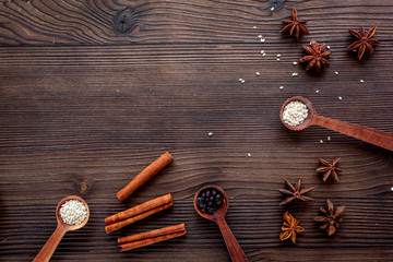 Flat lay vanilla, cinnamon, herb and spices on rustic kitchen background space for text