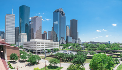 Panorama aerial view downtown Houston next to I-45 freeway during daytime, cloud blue sky. The most populous city in Texas and the fourth-most in United States. Transportation, architecture background
