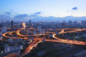 beautiful scenic top view of bangkok expressway and vehicle traffic roundabout  at twilight time