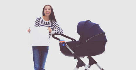 Full length portrait of a mother with a stroller holding blank, isolated on white background