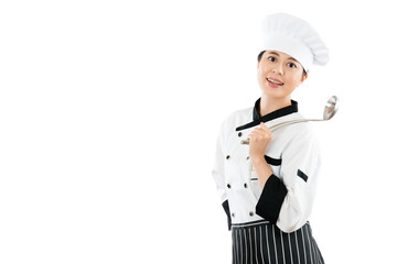 smiling restaurant chef holding a spoon.