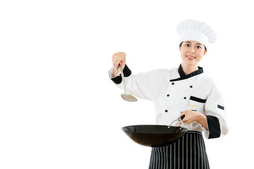 smiling chef holding wok with spatula cooking
