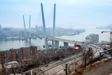 Fototapeta premium Russia, Vladivostok, April 8: Bridge over Golden Horn Bay