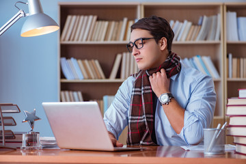 Young book writer writing in library