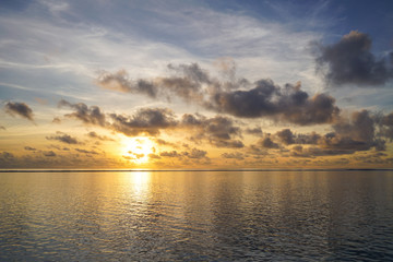 Fototapeta na wymiar Colorful sunrise over tropical ocean