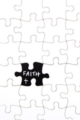 Puzzle Pieces - with word Faith in black chalkboard space
