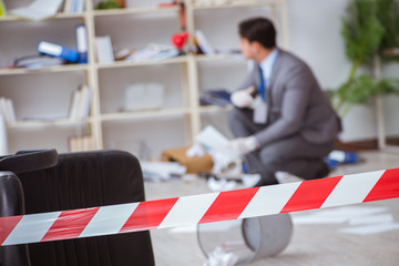 Young man during crime investigation in office