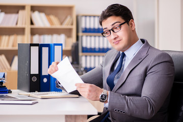Businessman receiving letter in the office