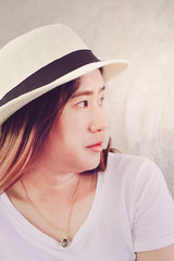 Close-up of face of young asian woman wearing hat lifestyle portrait