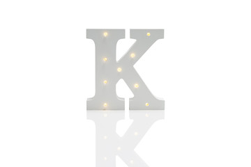 Decorative Letter K with Embedded LED Lights Over White Background