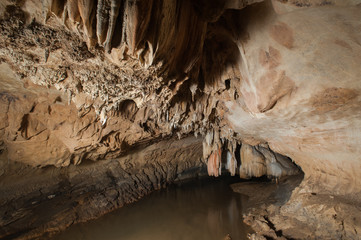 Stalactites and stalagmites in a cave,at national park of Thailand