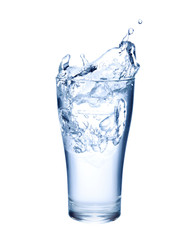Water splashing out of a glass isolated on white background.