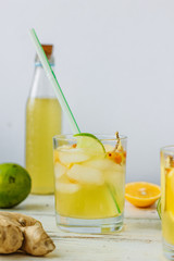 Fresh Ginger lemonade over white wooden background