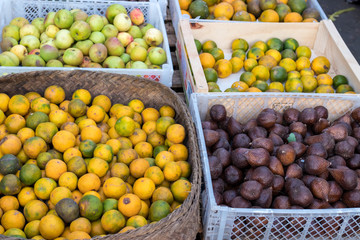 Fresh mandarin oranges on an organic food market of tropical Bali island, Indonesia. Mandarin background.