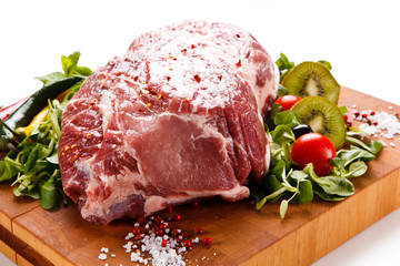 Fresh raw pork on cutting board on white background