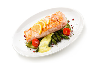 Grilled salmon with asparagus on white background