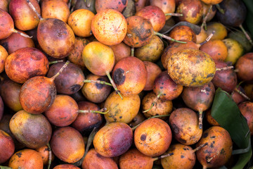 Close up of many passion fruit sin bamboo basket at local market. Organic food market, Bali island, Indonesia.