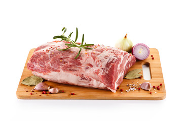 Fresh raw pork on cutting board on white background