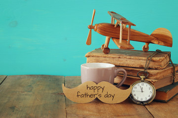 Cup of coffee with vintage father's accessories. Father's day concept