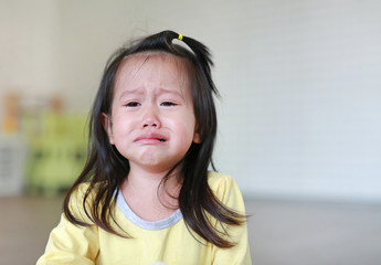 Close up Little kid girl crying with tearful on her face.