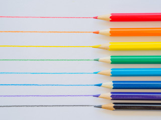 Color pencils on white paper. Education material back to school, for background and wallpaper.