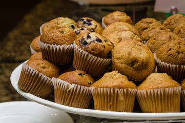 Plate of fresh blueberry and nut muffins