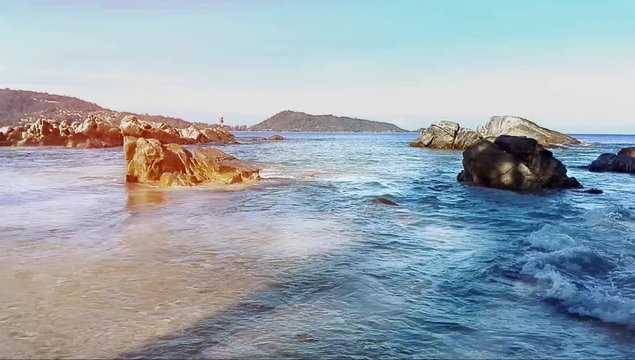 Motion of water wave in the sea landscape nature and bech sand with sky in morning light