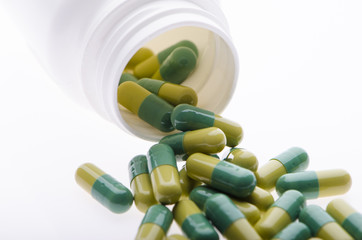 Container with green pills