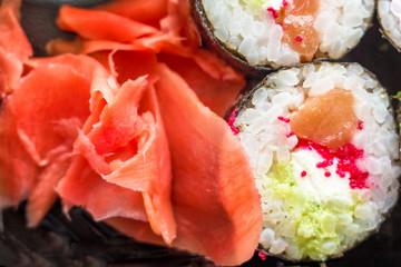 The plate of sushi with soy sauce, wasabi