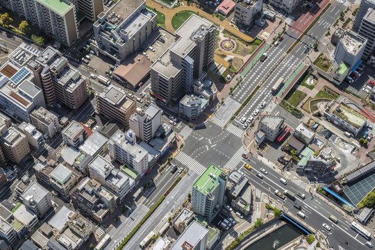 Tokyo urban area with streets and buildings, aerial top view, Japan