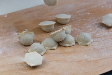 The process of making dumplings in the kitchen.