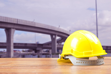 Safety helmet with construction site background
