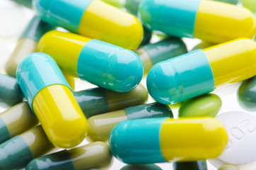  green pills background on the white