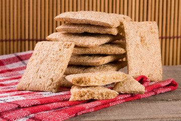 stack of crisp bread on a wooden table