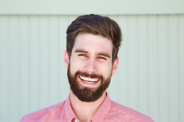 Close up smiling young man with beard