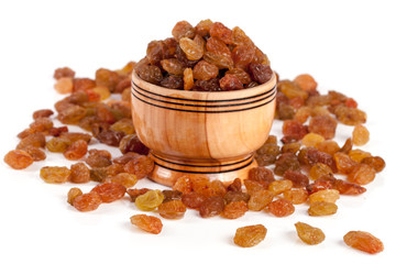 raisins in a wooden bowl isolated on white background