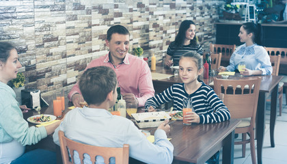 Family dining in cafe