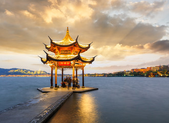 ancient pavilion of Hangzhou west lake at dusk, in China