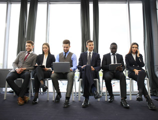 Stressful people waiting for job interview.