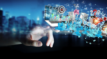 Businessman connecting devices and business objects together 3D rendering