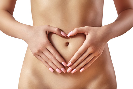 Beautiful female belly. Pretty woman cares stomach. Healthcare, digestion,  intestinal health. Wellness, spa. Body part Stock Photo