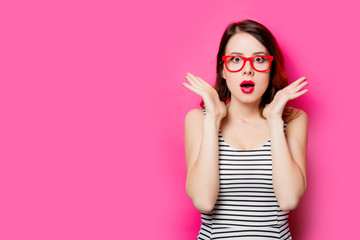 young surprised woman in glasses