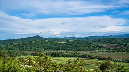 Fototapeta na wymiar View to the fields and mountains surrounding Village Kunino. Northwestern Bulgaria. part 2