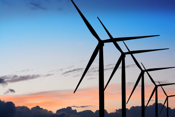 Wind turbines in sunset or dusk