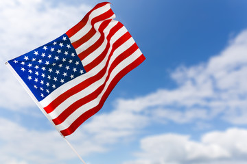 American flag against blue sky